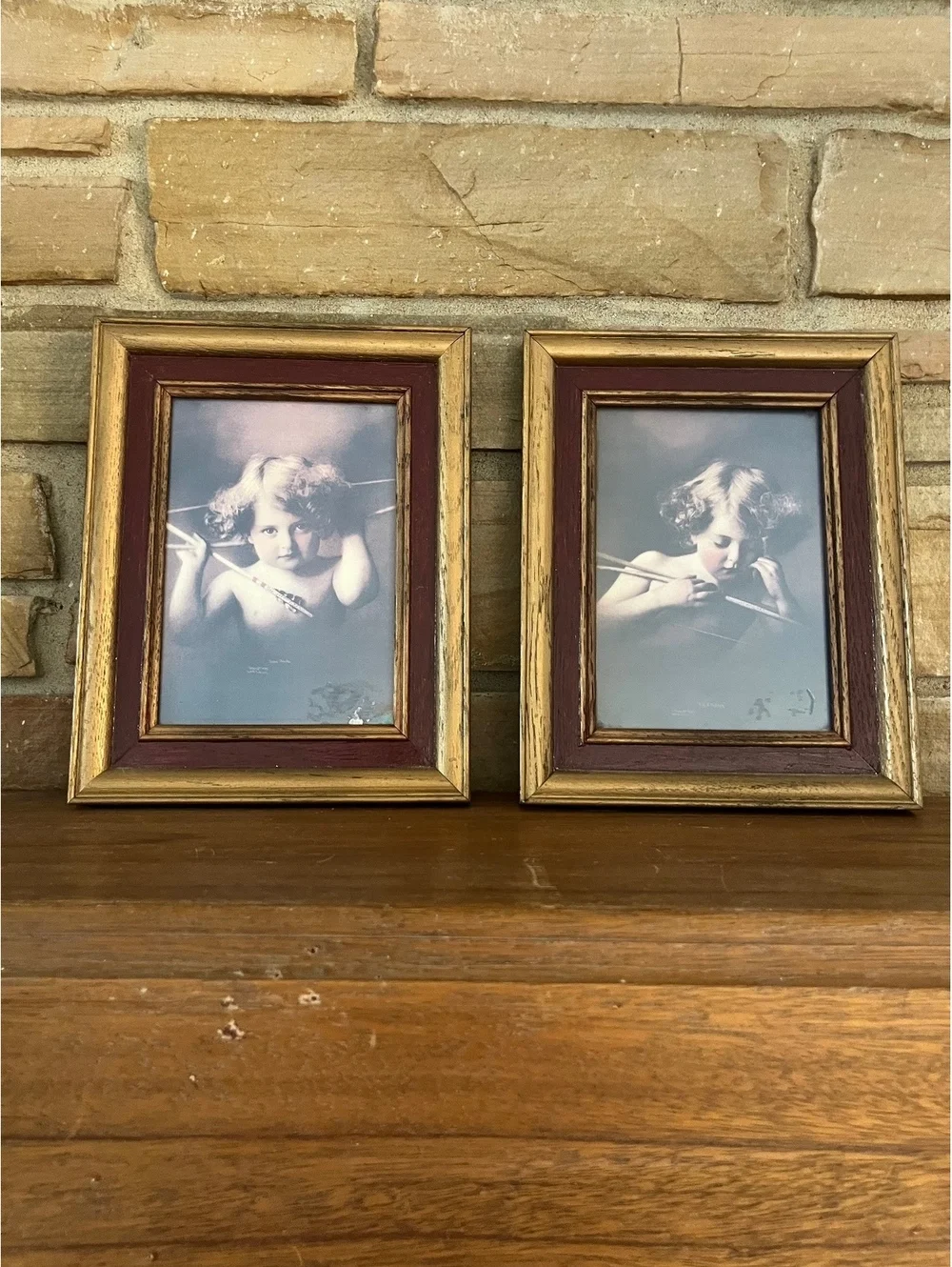 Pair of Vintage Framed Prints Featuring Cherubic Children with Arrows in Gold-Tw